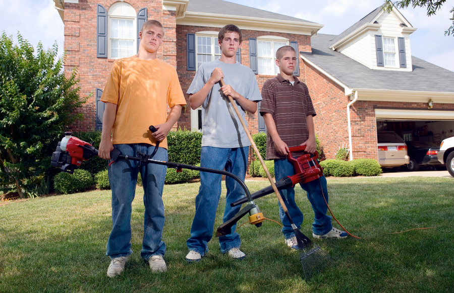 teenage boys clenaing the yard