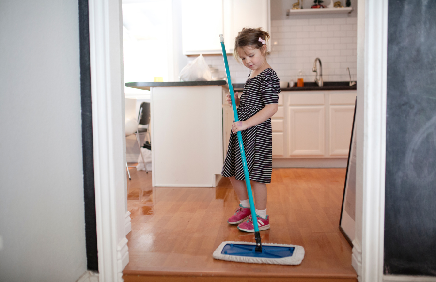 little girl doing household chores