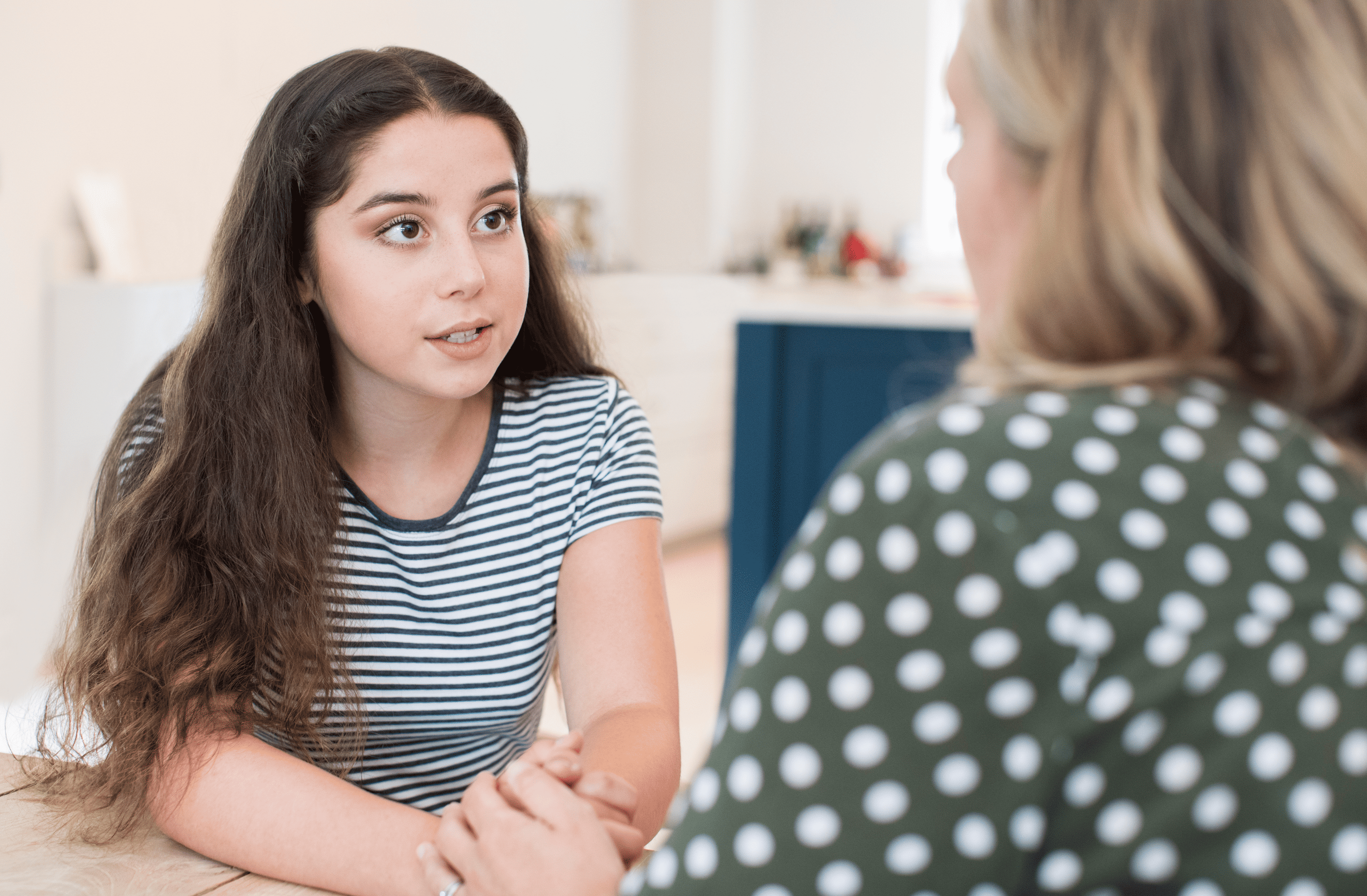 Mother talking seriously with teenager
